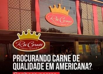 Fachada do açougue Rei Carnes em Americana, com logotipo em formato de coroa e letreiro em destaque na parte superior do prédio.