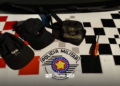 polícia militar prende dupla em farmácia arrombada em Andradina. #PraCegoVer policial em ação na farmácia
